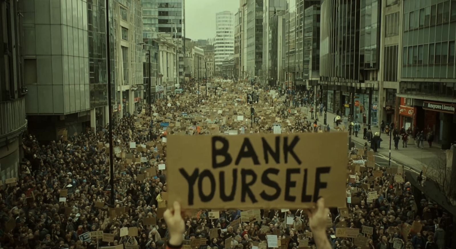 Bank Yourself — The movement takes the streets. The film’s largest set piece.